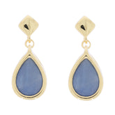 Elegant pear blue sapphire earrings in sterling silver, featuring a sparkling gemstone, perfect for sophisticated styles.
